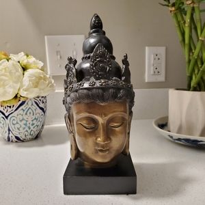 Vintage Buddha head on a stand. Cast metal with a bronze finish.